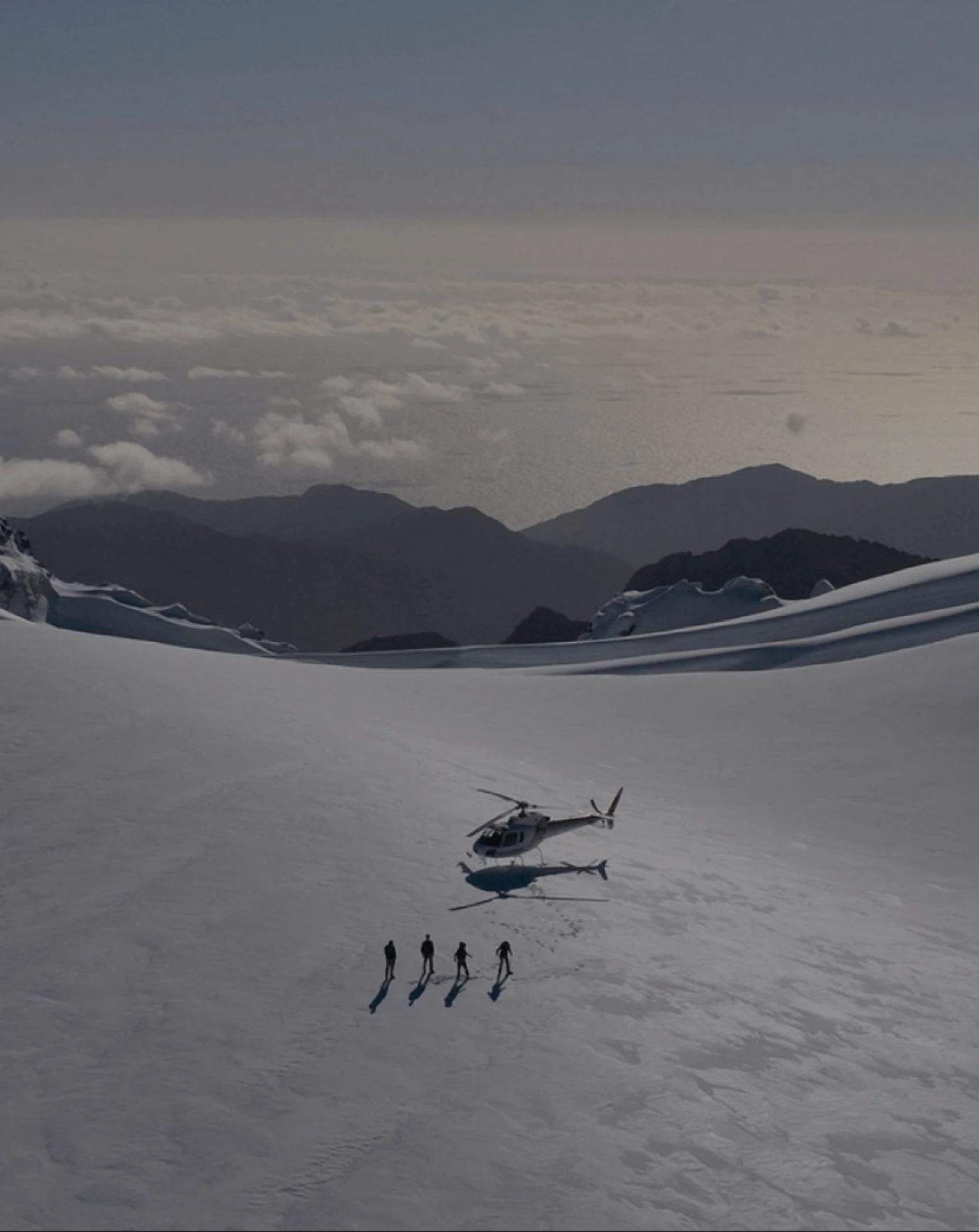 Helicopter with people in the mountains